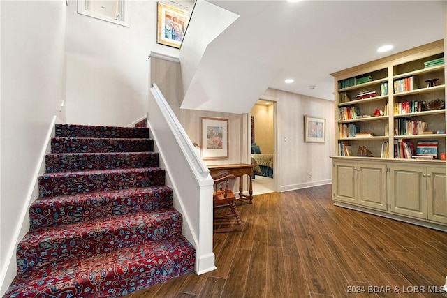 stairs with hardwood / wood-style flooring