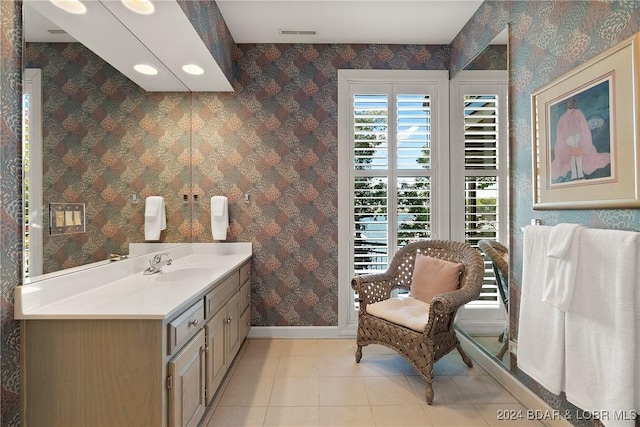 bathroom with tile patterned flooring and vanity