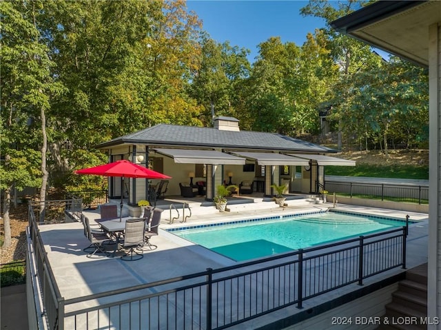 view of swimming pool with a patio area