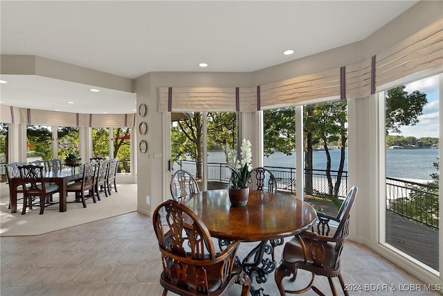 dining area featuring a water view