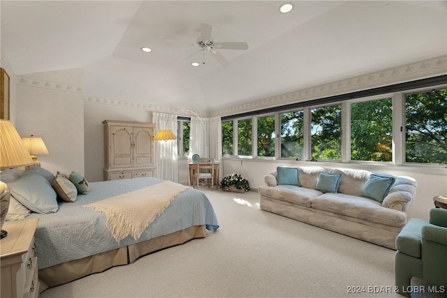 carpeted bedroom featuring ceiling fan and vaulted ceiling