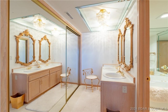 bathroom featuring double vanity, a sink, and visible vents