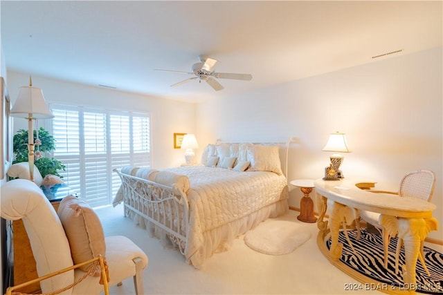 bedroom with carpet floors and a ceiling fan