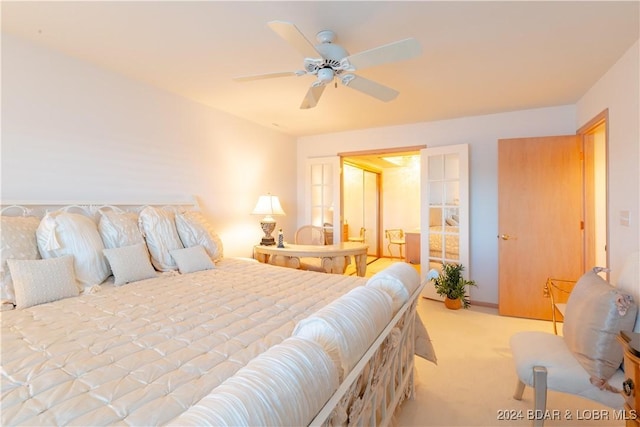 bedroom featuring light carpet and ceiling fan