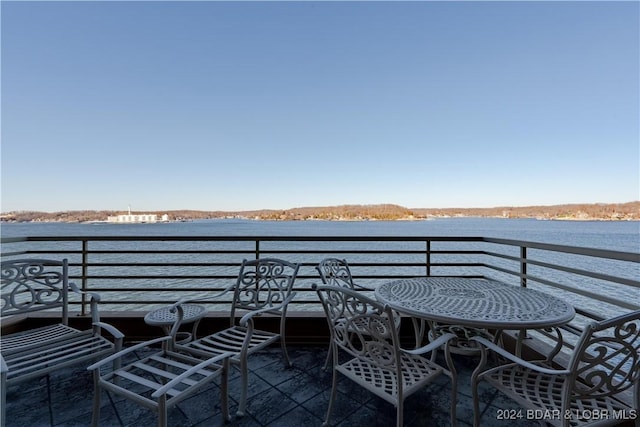 balcony featuring a water view