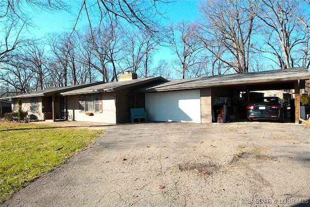 exterior space with a carport and a front lawn