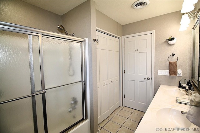 bathroom with tile patterned flooring and vanity