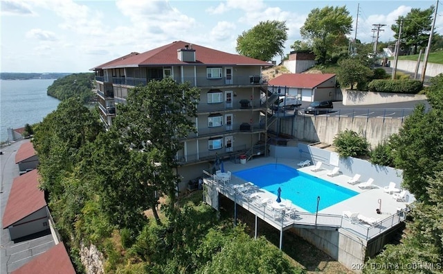 view of pool with a water view