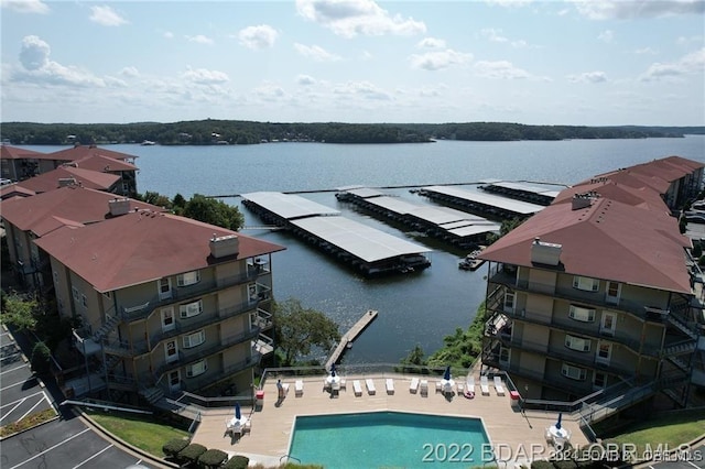 birds eye view of property featuring a water view