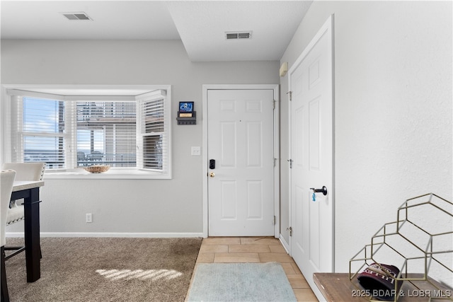 foyer entrance featuring light tile patterned floors