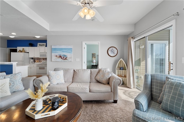 living room featuring carpet flooring and ceiling fan