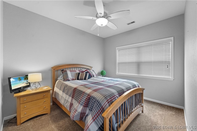 bedroom featuring ceiling fan and carpet