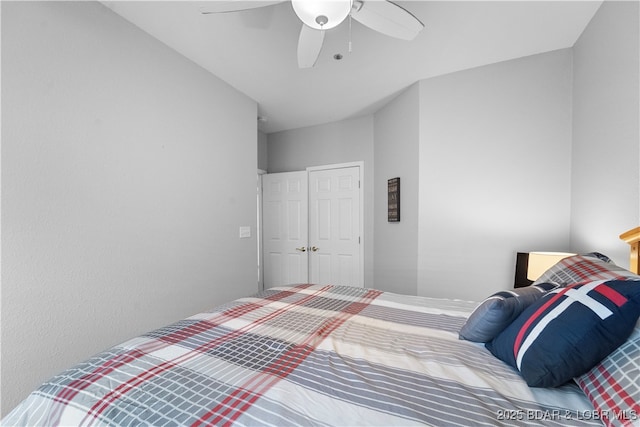 bedroom featuring ceiling fan and a closet