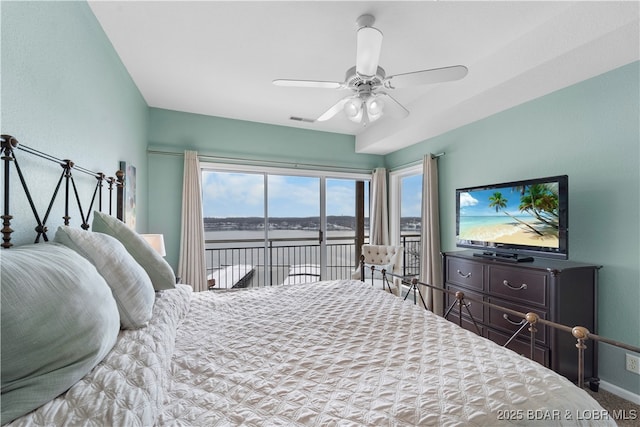 bedroom featuring access to outside, multiple windows, and ceiling fan