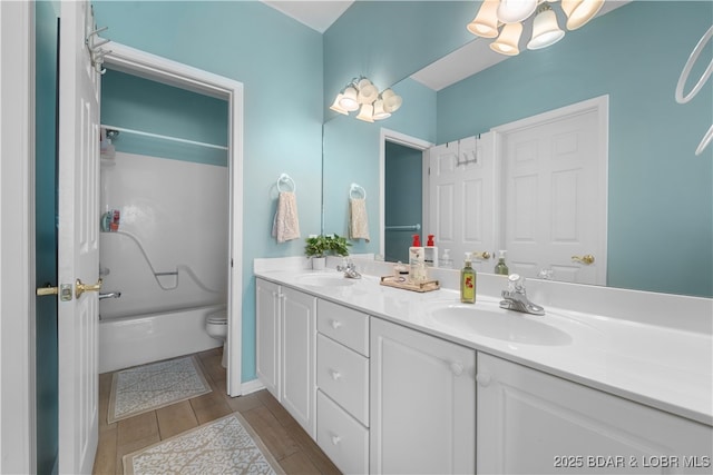 full bathroom with vanity, shower / bathtub combination, and toilet