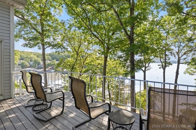 wooden deck with a water view