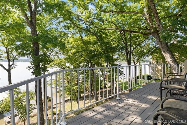 wooden deck with a water view