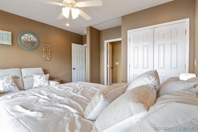 bedroom featuring ceiling fan and a closet