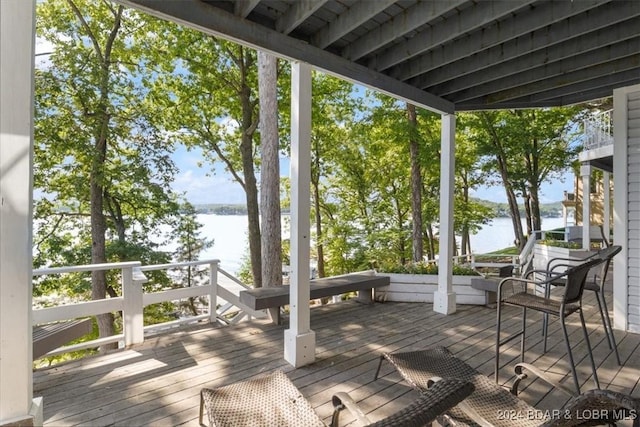 wooden deck with a water view