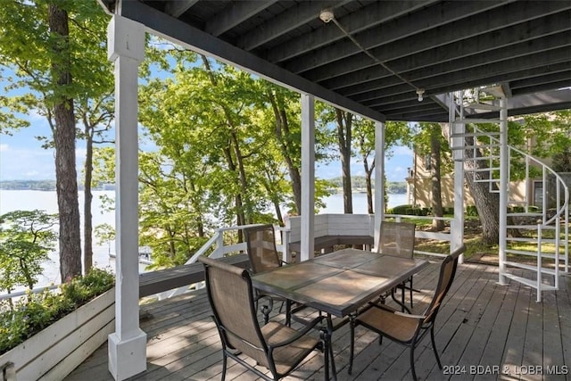 wooden terrace with a water view