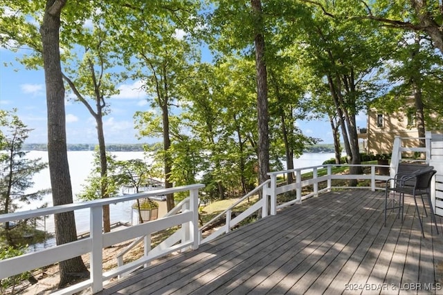 deck featuring a water view