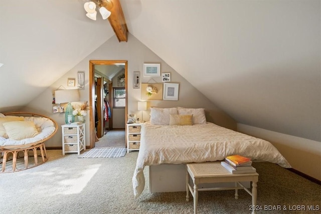 bedroom featuring carpet flooring and vaulted ceiling with beams