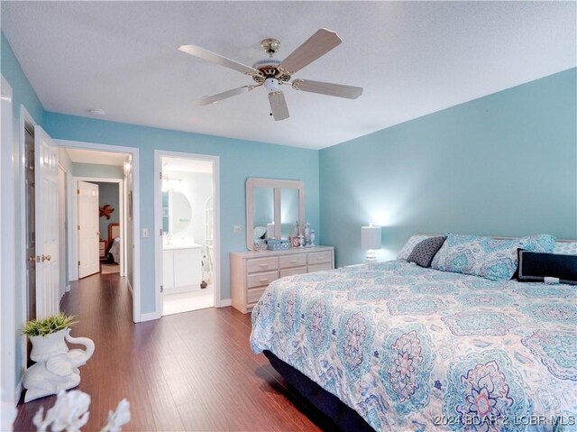 bedroom with ceiling fan, dark hardwood / wood-style floors, and connected bathroom