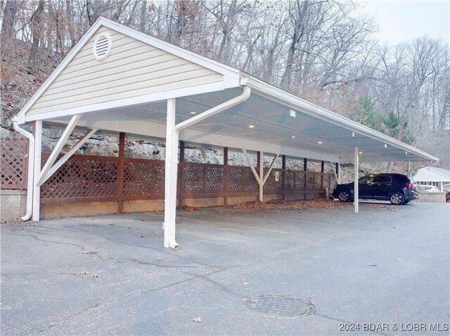 view of vehicle parking featuring a carport