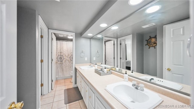 bathroom featuring vanity, tile patterned floors, toilet, and a shower with shower curtain