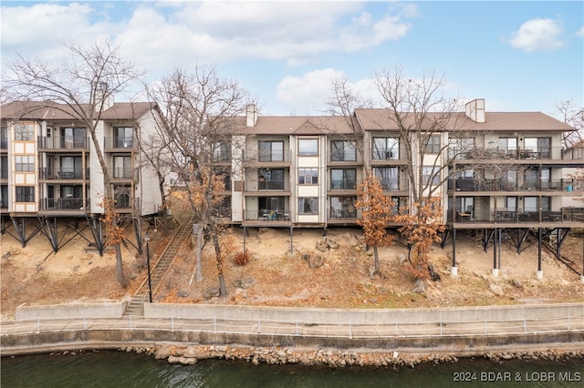 view of building exterior featuring a water view