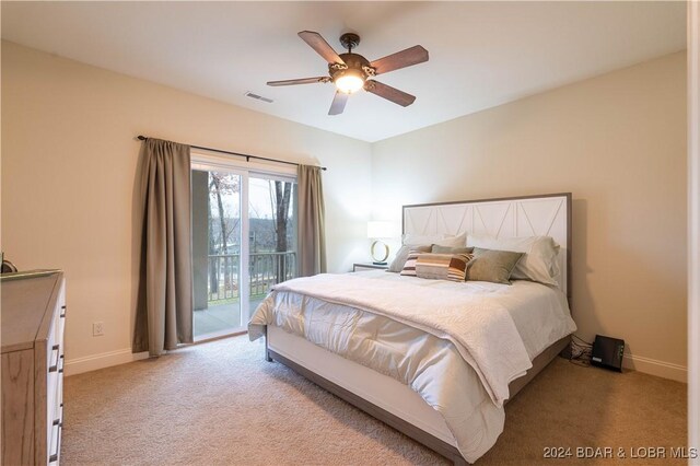 carpeted bedroom featuring access to exterior and ceiling fan