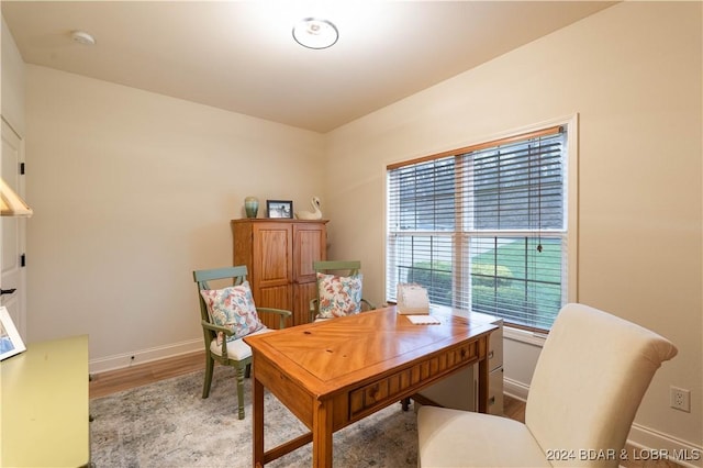 office with wood finished floors and baseboards