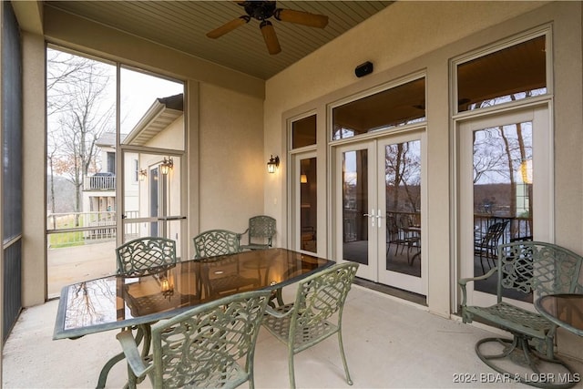 sunroom / solarium featuring ceiling fan, wooden ceiling, and french doors