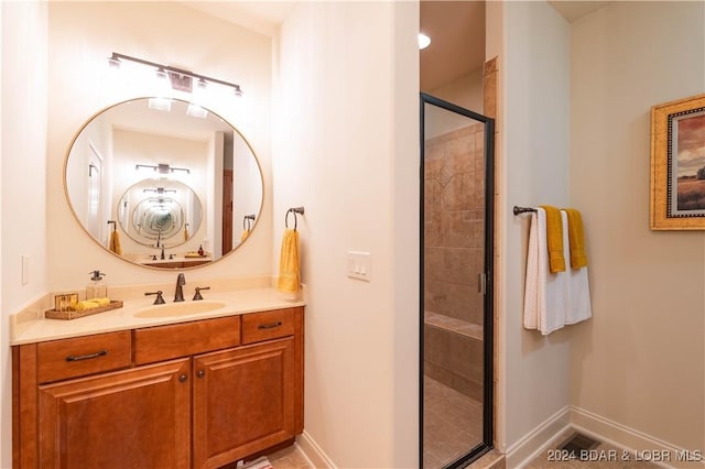 bathroom with vanity and an enclosed shower