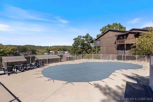 view of swimming pool featuring a patio