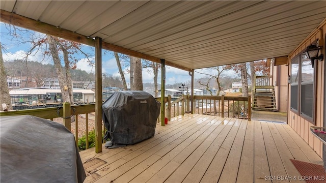 wooden terrace featuring grilling area