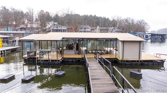 view of dock with a water view and boat lift