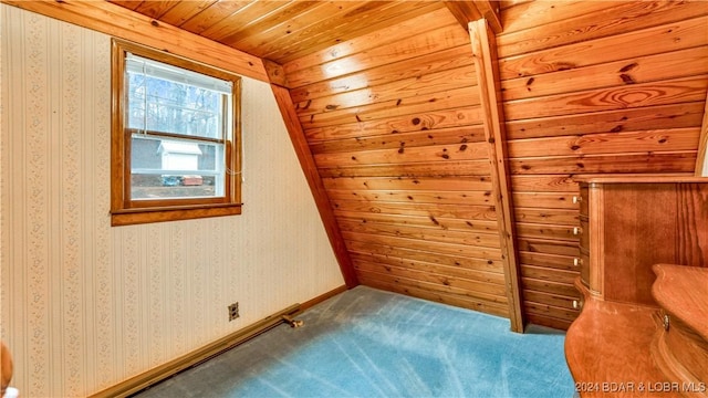 additional living space featuring carpet flooring, baseboards, and wallpapered walls