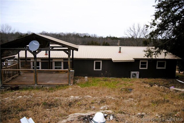 view of property exterior featuring a deck