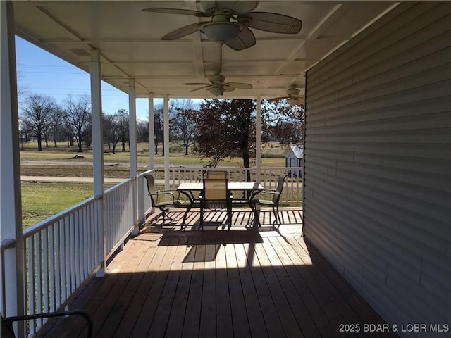 wooden terrace featuring ceiling fan