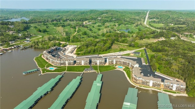 birds eye view of property with a water view