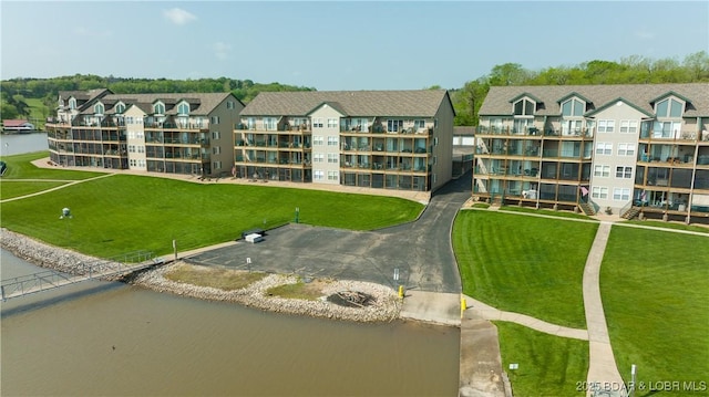 birds eye view of property featuring a water view