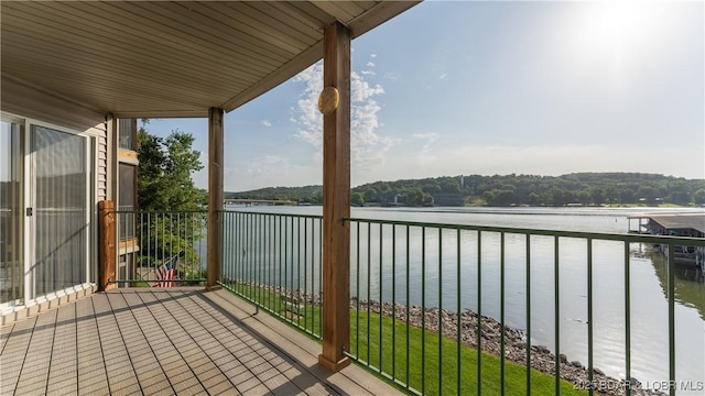 balcony featuring a water view