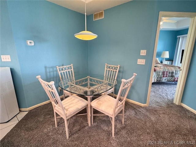 view of carpeted dining space