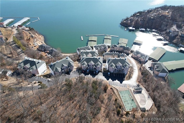 birds eye view of property with a water view