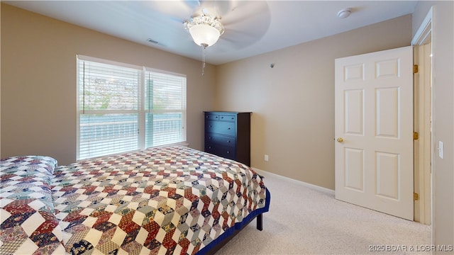 bedroom featuring ceiling fan and light colored carpet