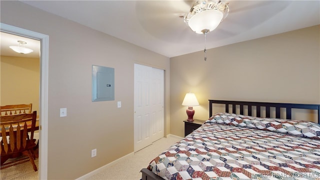 carpeted bedroom with electric panel and ceiling fan