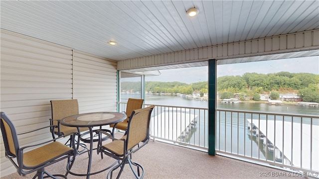 sunroom with a water view