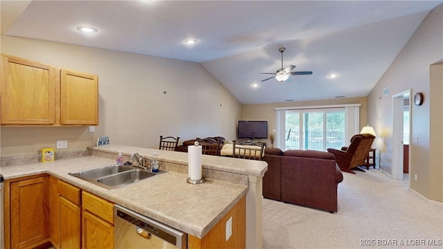 kitchen with sink, stainless steel dishwasher, kitchen peninsula, lofted ceiling, and light carpet