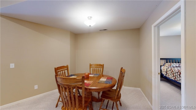 dining space with carpet floors